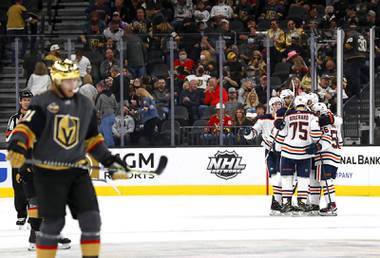 The Edmonton Oilers celebrate an empty net goal during the third period of an NHL hockey game Friday, Oct. 22, 2021, in Las Vegas.