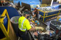 At a loading dock in the bowels of Caesars Palace, workers sift through bags of trash as they look for recyclable items. Crews work around the clock fishing out plastic bottles, cans and other recyclables from ...