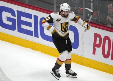 Vegas Golden Knights center Chandler Stephenson celebrates after scoring a goal against the Colorado Avalanche in the first period of an NHL hockey game Tuesday, Oct. 26, 2021, in Denver.