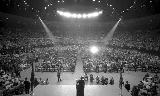 President John F. Kennedy speaks at the Las Vegas Convention Center in Las Vegas, Nevada, on September 28, 1963.  Photos include him arriving at McCarran Airport, pulling up to the convention center, and speaking in the rotunda. Governor Grant Sawyer, Senator Howard Cannon, and Senator Alan Bible are also pictured. This speech is part of an eleven-state conservation tour made by President John F. Kennedy. In his speech, the President commends the state of Nevada for its recent efforts to conserve natural resources, and proposes his administration's plan to preserve the natural environment, which consists of high quality education for children, natural resource conservation and development programs, and the promotion of peaceful international relations.