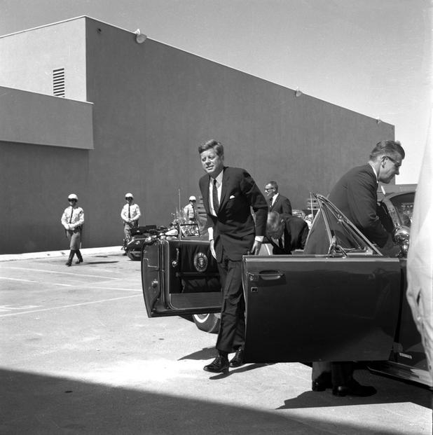 President John F. Kennedy speaks at the Las Vegas Convention Center in Las Vegas, Nevada, on September 28, 1963.  Photos include him arriving at McCarran Airport, pulling up to the convention center, and speaking in the rotunda. Governor Grant Sawyer, Senator Howard Cannon, and Senator Alan Bible are also pictured. This speech is part of an eleven-state conservation tour made by President John F. Kennedy. In his speech, the President commends the state of Nevada for its recent efforts to conserve natural resources, and proposes his administration's plan to preserve the natural environment, which consists of high quality education for children, natural resource conservation and development programs, and the promotion of peaceful international relations.