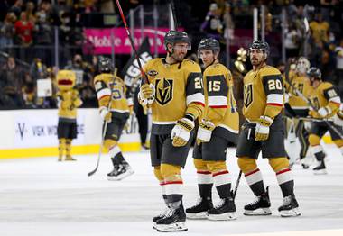 Vegas Golden Knights give a stick salute to fans after their 4-2 victory over the Seattle Kraken in an NHL hockey game at T-Mobile Arena Tuesday, Nov. 9, 2021. 