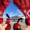 Showgirls wave as Virgin Atlantic Flight 155 from Heathrow Airport arrives as the first overseas flight after the U.S. border reopened to vaccinated travelers Monday, Nov. 8, 2021, at McCarran International Airport. 