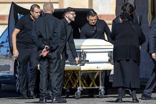 Pallbearers bring the casket into St. Simeon Serbian Orthodox Church before a memorial service for Tina Tintor Thursday, Nov. 11, 2021. Tintor, 23, was killed in a fiery crash involving former Raiders wide receiver Henry Ruggs III on Nov. 2.