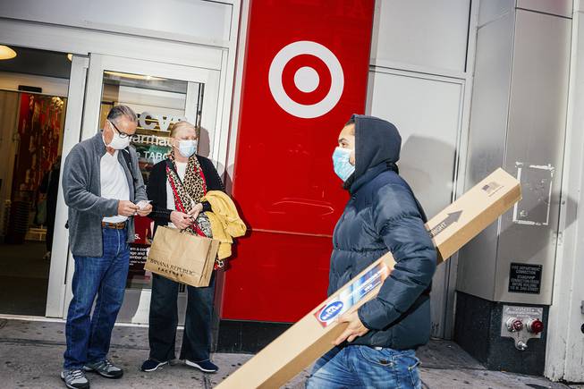 Shoppers outside a Target store in Manhattan, Oct. 27, 2021. Consumer demand and supply chain snarls are keeping inflation elevated. 