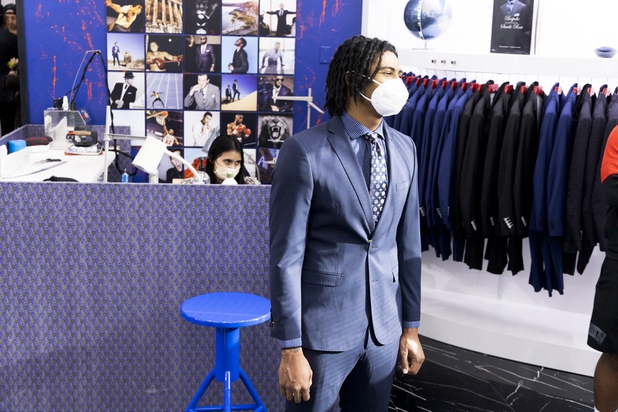 UNLV football player Noah Bean reacts during a suit fitting at Maceoo inside Aria Hotel & Casino, Thursday, Nov. 11, 2021. Through a partnership with Blueprint sports, former UNLV kicker Michael Chudd is sponsoring a program (now possible under the new NCAA NIL rules) that will give each graduating member of the UNLV football team a custom-made suit from Maceeo in exchange for social media sharing.