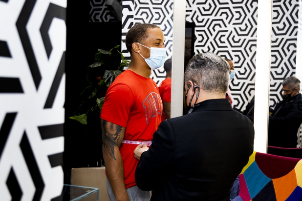 UNLV football player Tre Caine reacts during a suit fitting at Maceoo inside Aria Hotel & Casino Thursday, Nov. 11, 2021. Through a partnership with Blueprint sports, former UNLV kicker Michael Chudd is sponsoring a program (now possible under the new NCAA NIL rules) that will give each graduating member of the UNLV football team a custom-made suit from Maceeo in exchange for social media sharing.