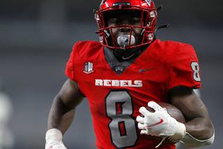 UNLV Rebels running back Charles Williams (8) scores a touchdown during the second half of a NCAA football game at Allegiant Stadium Saturday, Nov. 13, 2021.
