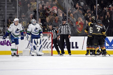 The Vegas Golden Knights celebrate a goal against the Vancouver Canucks during the first period of an NHL hockey game Saturday, Nov. 13, 2021, in Las Vegas. (AP Photo/David Becker)
