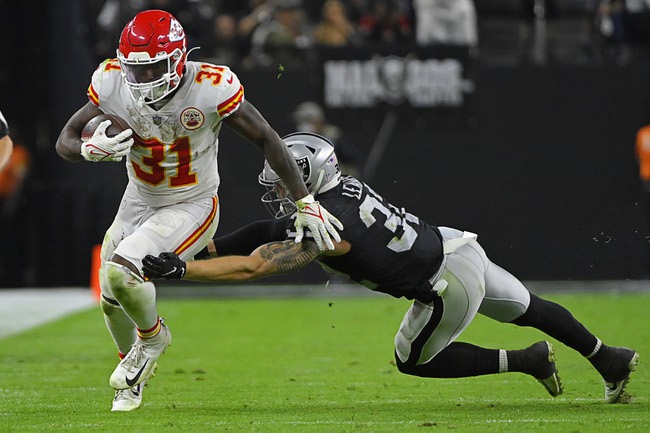 Kansas City Chiefs running back Darrel Williams (31) runs past Las Vegas Raiders defensive back Dallin Leavitt (32) during the second half of an NFL football game, Sunday, Nov. 14, 2021, in Las Vegas. (AP Photo/David Becker)