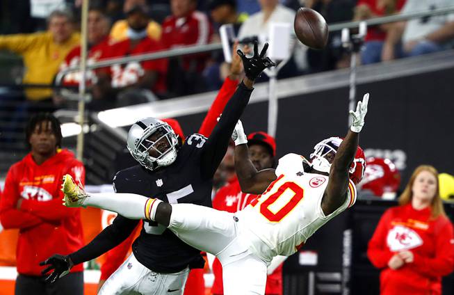 Las Vegas Raiders cornerback Brandon Facyson (35) breaks up a pass intended for Kansas City Chiefs wide receiver Tyreek Hill (10) during the first half of an NFL football game at Allegiant Stadium Sunday, Nov. 14, 2021.