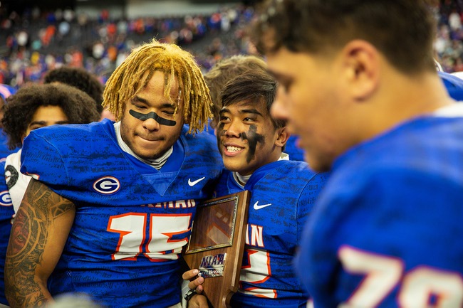 Bishop Gorman High School celebrates their 56-7 win against McQueen High of Reno in the 5A high school football championship at Allegiant Stadium on Thursday Nov. 18, 2021.