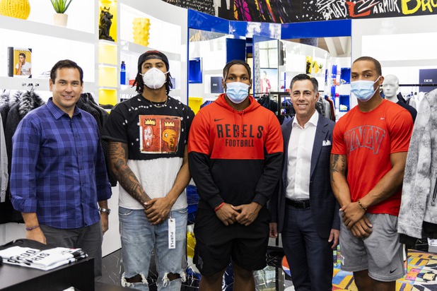 Cisco Aguilar from Blueprint Sports, far left, and Michael Chudd, 2nd to right, pose with UNLV football players (from left) tight end Noah Bean, middle linebacker Farrell Hester, and safety Tre Caine during a suit fitting at Maceoo inside Aria Hotel & Casino Thursday, Nov. 11, 2021. Through a partnership with Blueprint sports, former UNLV kicker Michael Chudd is sponsoring a program (now possible under the new NCAA NIL rules) that will give each graduating member of the UNLV football team a custom-made suit from Maceeo in exchange for social media sharing.
