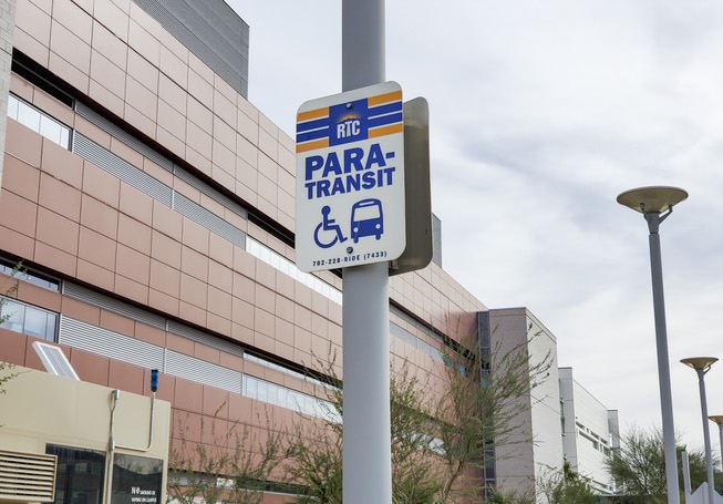 A bus stop sign for the the North Las Vegas VA Medical Center is seen outside the hospital, Thursday, Nov. 11, 2021. Veterans Transportation Service offers a free shuttle to the VA hospital in North Las Vegas for veterans. 