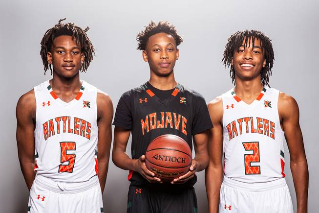 Players of the Mojave High basketball team, from left Ja'Marion Smith, C.J. Shaw and Giali Chapman, take a portrait during the Las Vegas Sun's High School Basketball Media Day at the Red Rock Resort and Casino, Nov. 1, 2021.