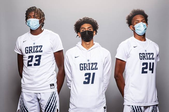 Players of the Spring Valley High basketball team, from left Pharaoh Compton, Alijah Adem and Desean Moreno, take a portrait during the Las Vegas Sun's High School Basketball Media Day at the Red Rock Resort and Casino, Nov. 1, 2021.