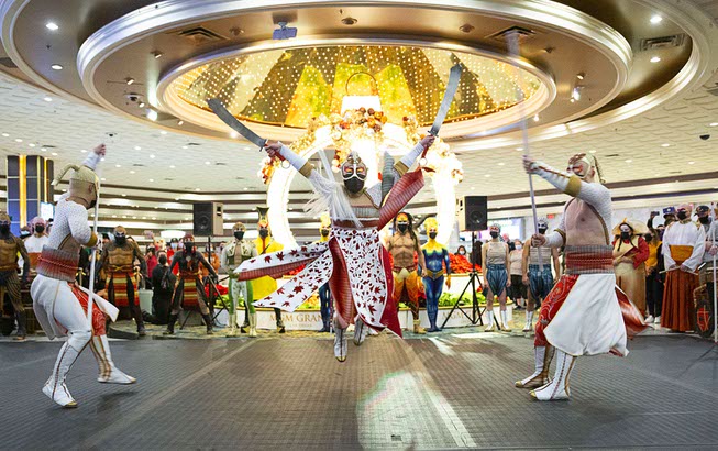 KA cast members battle during a pop-up performance in the hotel lobby celebrating the return of KA by Cirque Du Soleil at MGM Grand Wednesday, Nov. 24, 2021.