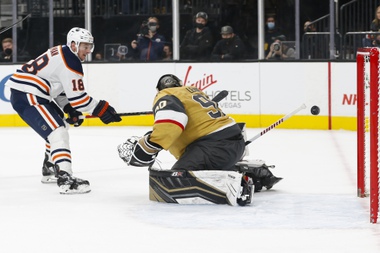 Edmonton Oilers left wing Zach Hyman (18) scores a goal past Vegas Golden Knights goaltender Robin Lehner (90) during the first period of an NHL hockey game Saturday, Nov. 27, 2021, in Las Vegas. (AP Photo/Chase Stevens)