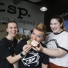From left, Counter Manager Abbi Haskell, Owner of Tsp. Baking Company Kari Garcia and Cake Decorator Lauren Poulos pose for a photo Tuesday, Dec. 7, 2021.