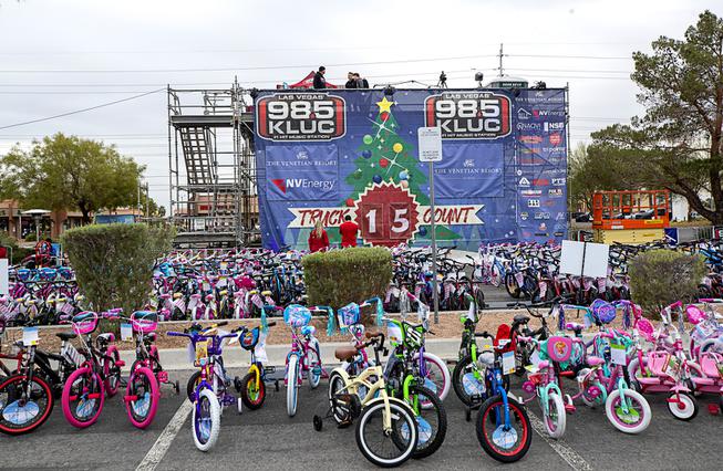 Donated bicycles line the front of a platform set up in the NV Energy parking lot Tuesday, Dec. 7, 2021, during the 23rd annual 98.5 KLUC-FM Toy Drive. 