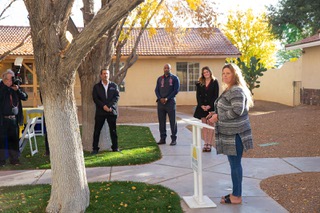 Wendy Hayes, of D.R. Horton, makes a few remarks during the unveiling of the newly renovated homes at New Vista Ranch, which provides homes for individuals with Intellectual and Developmental Disabilities (IDD), Wed. Dec. 8, 2021. The project was a collaboration between New Vista and HomeAid, with construction donated and funded by local home builders Toll Brothers, Woodside Homes, Shea Homes and D.R. Horton.