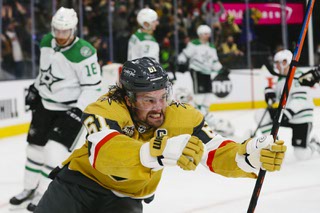 Vegas Golden Knights right wing Mark Stone (61) reacts after scoring against Dallas Stars goaltender Braden Holtby (70) during the third period of an NHL Hockey game at T-Mobile Arena Wednesday, Dec. 8, 2021.