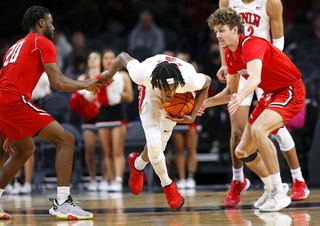 UNLV Rebels forward Donovan Williams steals the ball from Hartford Hawks guard Austin Williams, left, during a NCAA basketball game at the Michelob Ultra Arena in Mandalay Bay Saturday, Dec. 11, 2021.