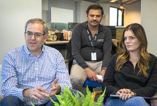 Tom Rafferty, left, co-CEO, responds to a question during an interview with Brooke Fiumara, co-CEO, and Rukku Rupanagudi, center, chief technology officer, at the OPTIX offices Wednesday, Dec. 15, 2021.