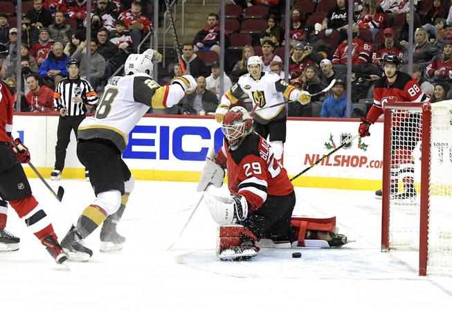 Vegas Golden Knights left wing William Carrier (28) celebrates after scoring a goal past New Jersey Devils goaltender Mackenzie Blackwood (29) during the second period of an NHL hockey game Thursday, Dec.16, 2021, in Newark, N.J. 