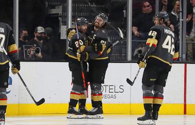 Vegas Golden Knights right wing Mark Stone (61) celebrates with center Chandler Stephenson (20) after scoring during the second period of an NHL hockey game against the Tampa Bay Lightning at T-Mobile Arena Tuesday, Dec. 21, 2021.