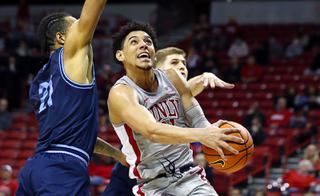 UNLV Rebels guard Marvin Coleman (31) lays up the ball past San Diego Toreros forward Terrell Brown (21) during the second half of an NCAA basketball game at the Thomas & Mack Center Wednesday, Dec. 22, 2021.