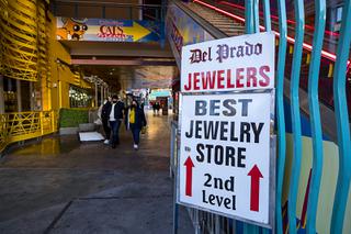 A sign at the Neonopolis mall points the way to Del Prado Jewelers in downtown Las Vegas Friday, Dec. 24, 2021. Johnny Del Prado closed his store on Christmas Eve after over 30 years in business downtown. His father Juan Del Prado Jr. started the business in the Commercial Center on East Sahara Avenue in 1975.