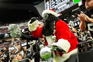 Raiders fans cheer as Vegas begins the second half of their game agains the Denver Broncos at Allegiant Stadium Sunday, Dec. 26, 2021. The Raiders defeat the Denver Broncos 17-13.