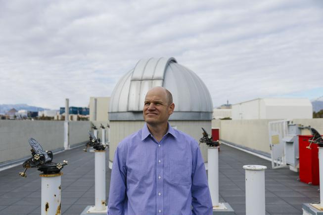 UNLV physics professor Jason Steffen, who studies exoplanets, or planets that orbit distant stars, poses for a photo on the roof of the Bigelow Physics Building at UNLV Tuesday, Dec. 28, 2021.