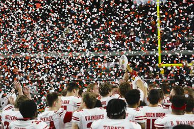 Wisconsin players hoist the championship trophy after defeating Arizona State, 20-13, during the SRS Distribution Las Vegas Bowl at Allegiant Stadium Thursday, Dec. 30, 2021.