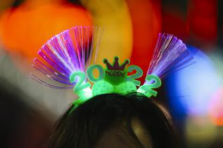 A reveler wears a light up head band on New Years Eve Friday, Dec. 31, 2021.