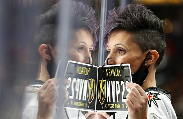 A fans holds a replica license plate during an NHL hockey game between the Vegas Golden Knights and the Chicago Blackhawks at T-Mobile Arena Saturday, Jan. 8, 2022.