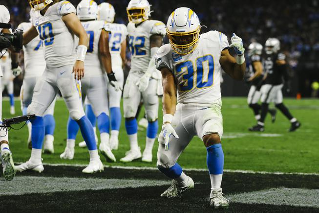 Los Angeles Chargers running back Austin Ekeler (30) dances after making a touchdown during the first half of an NFL football game against the Los Angeles Chargers at Allegiant Stadium Sunday, Jan. 9, 2022.