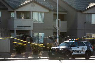 Metro Police investigate after a shooting that left two officers wounded and a person dead in the 3000 block of Nellis Boulevard near Vegas Valley Drive on Monday, Jan. 10, 2022.