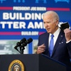 President Joe Biden begins to speak about the Bipartisan Infrastructure Law at the South Court Auditorium in the Eisenhower Executive Office Building on the White House Campus in Washington, Friday, Jan. 14, 2022.