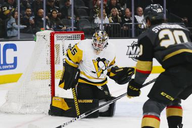 Vegas Golden Knights center Chandler Stephenson (20) scores past Pittsburgh Penguins goaltender Tristan Jarry (35) during the first period of an NHL hockey game at T-Mobile Arena Monday, Jan. 17, 2022.