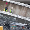 Workers continue demolition of the U.S. 95 bridge over Eastern Avenue Friday, Jan. 21, 2022. A worker was injured Thursday when a girder unexpectedly collapsed during demolition of the bridge.