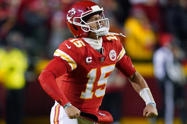 Kansas City Chiefs quarterback Patrick Mahomes (15) celebrates after throwing a touchdown pass during the first half of an NFL divisional round playoff football game against the Buffalo Bills, Sunday, Jan. 23, 2022, in Kansas City, Mo.

