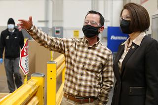 Richard Guy, director of operations at TemperPack, gives a tour of the manufacturing facility with Sen. Catherine Cortez Masto, D-Nev., Wednesday, Jan. 26, 2022.