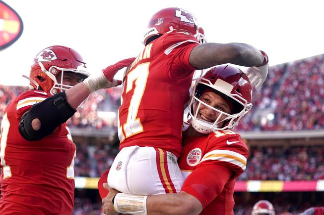 Kansas City Chiefs wide receiver Mecole Hardman (17) celebrates with quarterback Patrick Mahomes, right, after catching a 3-yard touchdown pass during the first half of the AFC championship NFL football game against the Cincinnati Bengals, Sunday, Jan. 30, 2022, in Kansas City, Mo.



