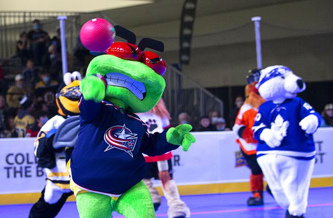 Columbus Blue Jackets mascot Stinger throws a ball in a ...