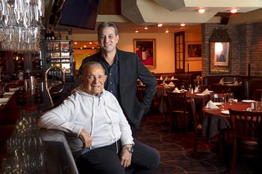 Owner Freddie Glusman and his son Evan pose at Pieros Italian Cuisine, across from the Las Vegas Convention Center, Wednesday, Feb. 9, 2022. The restaurant opened near downtown in 1982 and moved to its current location in 1987.