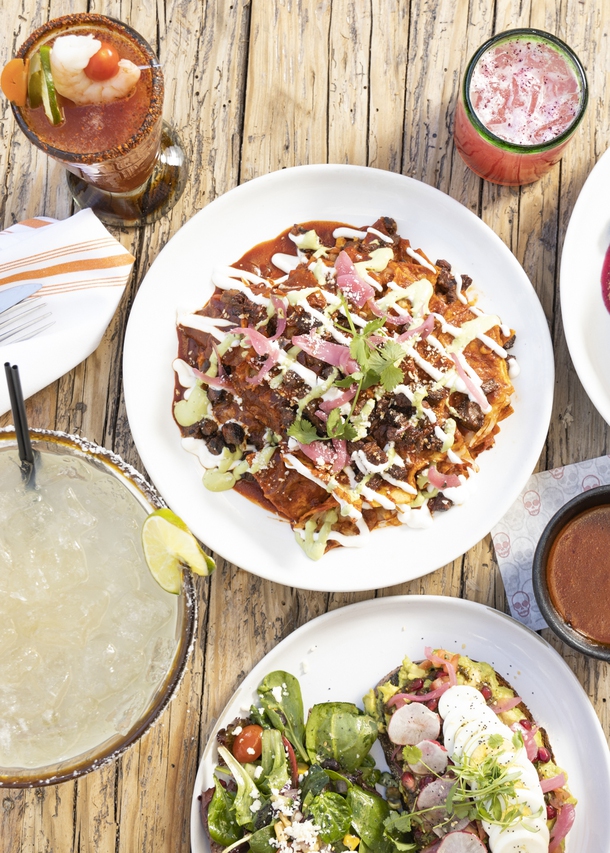 Clockwise from top left: Maria Maria cocktail, Hibiscus Margarita cocktail, Carne Asada Chilaquiles, Catrina Avocado Toast, and the Calavera Margarita from Casa Calavera Wed. Feb. 9, 2022. YASMINA CHAVEZ