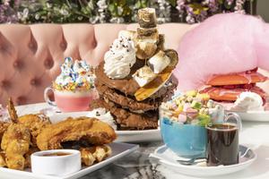 From left: Chicken and Waffles, Pink Unicorn Hot Chocolate,  Banana Nutella Lovers Pancakes, Lucky Charm Blue Latte and the Pink Cloud Pancake Stack at Sugar Factory on Harmon Corner, Thursday, Feb. 10, 2022. 