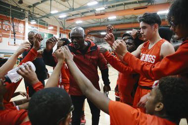 Valley Vikings head coach Willie Scott huddles with his team during a game against the Mojave Rattlers at Mojave High School Wednesday, Feb. 16, 2022.
